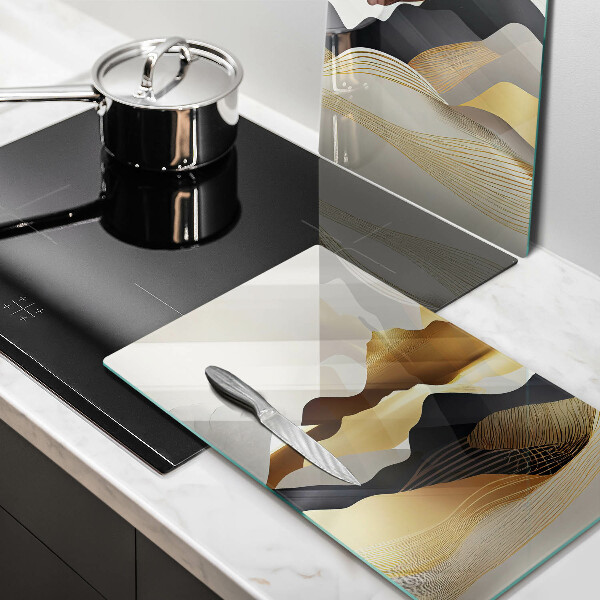Üveg vágódeszka Absztrakt arany hegyek