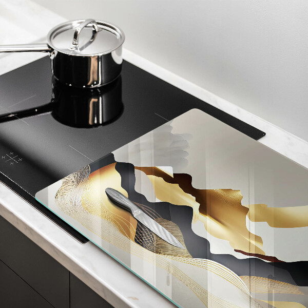 Üveg vágódeszka Absztrakt arany hegyek