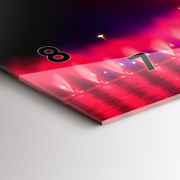 Vízszintes üvegóra Wroclaw-kút éjjel